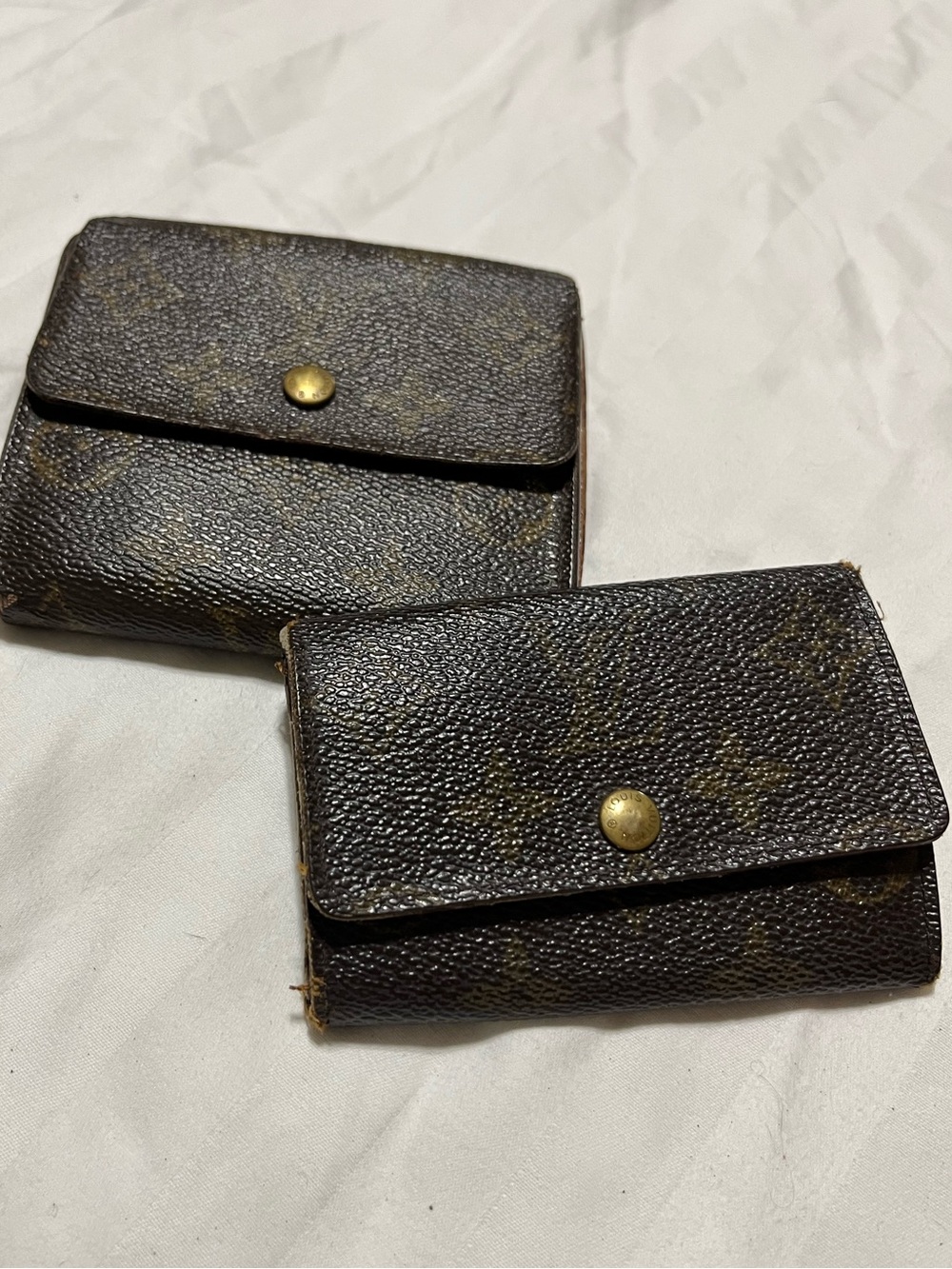 A Pair of Louis Vuitton Brown Monogram Canvas Wallet and Key Holder